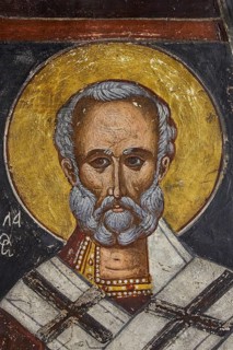 Agios Nikolaos, portrait of a saint with halo, golden tones are dominant in the depiction, Easter