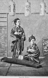 Japanese girls, two young woman with musical instruments on a bast mat in the house, stringed
