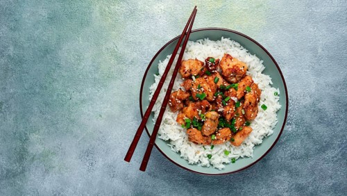 Fried chicken teriyaki with rice, green onion and sesame, homemade, no people