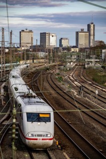 Train on the tracks west of Essen central station, skyline of the city centre, ICE train, North