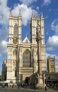 Towers and frontage of Westminster abbey church with Victoria Tower in background, Westminster,