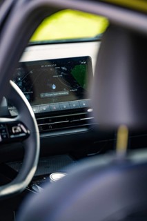 Close-up of a car interior, focus on a screen with navigation view, e-car sharing, Deer Mobility,