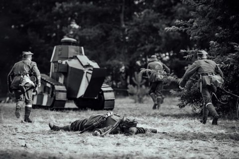 A staging battle field in World War I - attack tank and soldiers