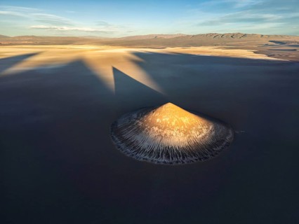 Top view, the stunning Cono de Arita rises dramatically from the salt flats of Salta, Argentina.