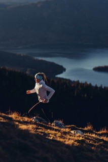 Trail running in autumn on the Jochberg on Lake Walchensee against the wonderful backdrop of the