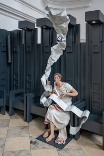 Modern sculpture of St Augustine in the modern choir stalls of St Augustine's Church,