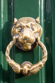 Brass face head lion door knocker, Devizes, Wiltshire, England, UK