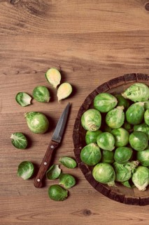 Fresh Brussels sprouts, raw, top view, on a wooden table, no people