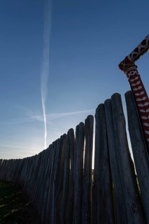 Condensation trails from aeroplanes over the Pömmelte ring sanctuary, prehistoric circular ditch,