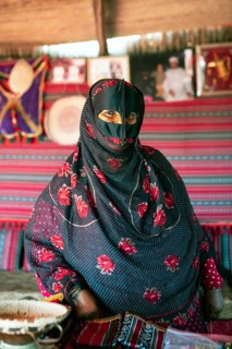 Bedouin woman, 60 years old, with face mask, Wahiba Sands or Rimal Al Wahiba or Sharqiyya Sands