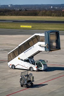 Dortmund Airport, DTM, apron, in front of the terminal, runway, mobile passenger stairs waiting for