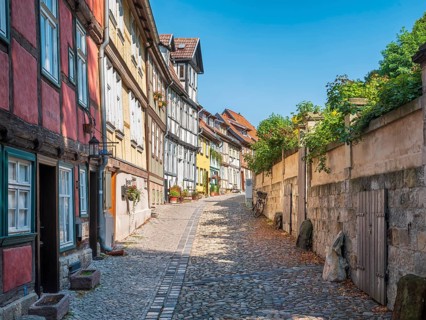 Narrow alley with half-timbered houses and cobblestones on Burgberg in the historic old town,