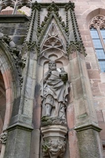 Sculpture to the right of the main entrance portal of St Nicholas and St Ulrich Church, Kirchenberg