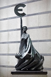 The bronze statue entitled Europe by May Claerhout holds up the euro symbol, Rue Wiertz, European
