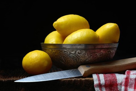 Mini lemons in peel with knife, lemon snack, snack lemon, lemon variant