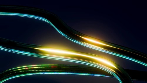 Abstract image 3D of glowing curved lines with vibrant light reflections on a dark background. The
