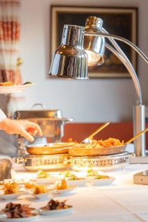 A fine buffet in the restaurant is lovingly presented under a lamp, Europäischer Hof, Königsbach
