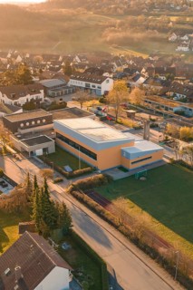 School complex next to residential buildings in an autumn landscape, Schlehengäuschule, Gechingen,