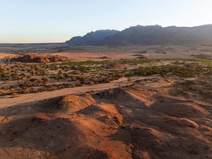 Aerial view, dry riverbed and desert landscape on the Ugab River, behind Brandberg, Erongo,