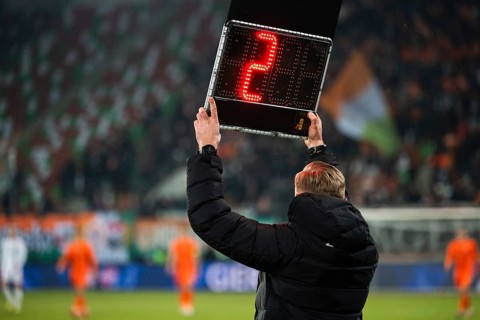 Technical referee shows 2 minutes added time during the football match in Lubin, Poland