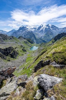 View of mountain lake Lac du Louvie and glaciated mountain peaks of the Grand Combine, Valais Alps,
