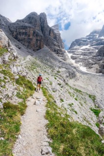 Female hiker in the mountains, Castelletto Superiore and Cima Sella, back Scharte Bocca di Tuckett,