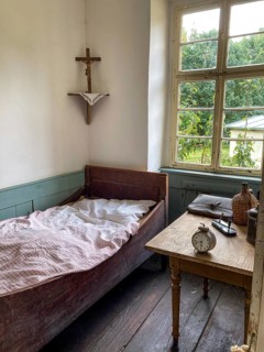 Bedroom with bed in Herrgottswinkel in schoolhouse in open-air museum Neuhausen, Neuhausen ob Eck,