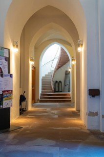 A vaulted hallway with a spiral staircase and soft interior lighting, Nagold, Black Forest, Germany