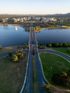 From above, a drone captures the stunning cityscape of Canberra, Australia, with a prominent