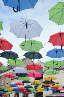 Many umbrellas hang over the street in Vejle, Jutland, Denmark, Scandinavia