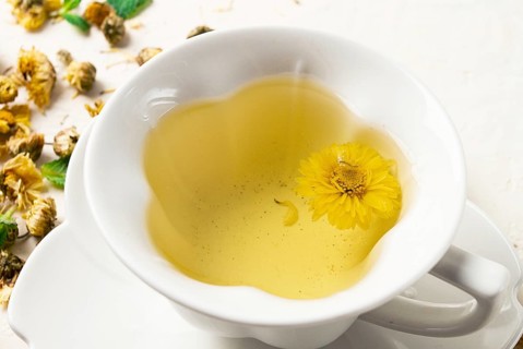 Chrysanthemum tea, drink, white cup, mint, chrysanthemum buds, close-up, no people