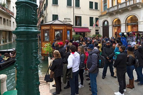 Tourists waiting for gondola rides, Venice, Veneto, Italy