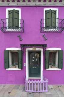 Fabulous house with fence in front of the entrance door in Burano, Venice, Veneto, Italy