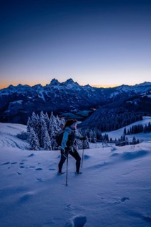 Hiking in the snow in the snow-covered winder landscape in the Alps at Neunerköpfle in the