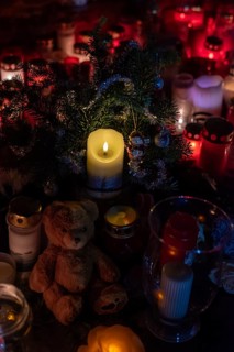 Commemoration of attack, small teddy bear and candles commemorate 20 December 2024, a man