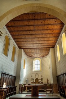 Interior of Saint-Sebastien Church in Manglieu, featuring Romanesque arches, Puy de dome