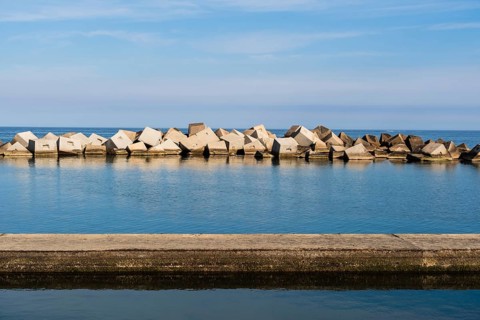 Cube-shaped blocks as breakwaters near the Forum in Barcelona, Spain