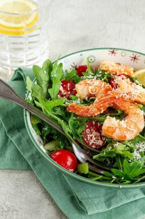Shrimp salad with arugula and cherry tomatoes, with parmesan cheese, healthy food