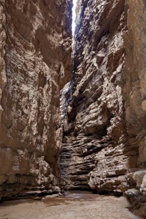 A narrow, rocky gorge with high, steep cliffs, rocky landscapes and gorges in the landscape of the