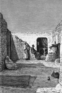 Courtyard of a house in the Algerian date oasis Ouargla, Arab woman, man, carpets, jug, stairs,
