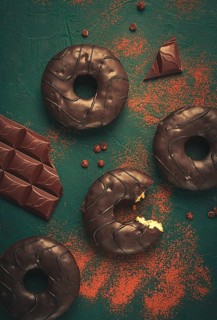 Donuts with cocoa, in chocolate glaze, top view, no people