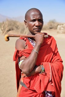 Maasai man holding a traditional shepherd's stick, Ngorongoro Conservation Area, Ndema, Tanzania