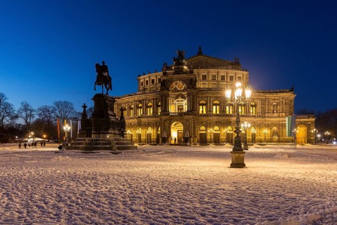 Illuminated Semper Opera House and Theatre Square with snow at dusk, Old Town of Dresden, Saxony,