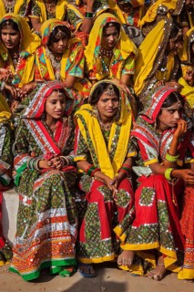 PUSHKAR, INDIA, NOVEMBER 21, 2012: Unidentified Rajasthani girls in traditional outfits prepare for