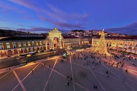 Praca do Comercio shines with a large illuminated Christmas tree and vibrant decorations, as crowds