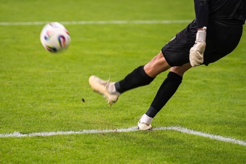 Goalkeeper kicks the ball during the soccer match in Lubin, Poland