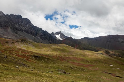 This vivid image captures the stunning natural beauty of Peru's Andean mountains, showcasing lush