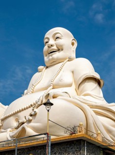 Statue of Budai - Laughing Buddha, Vinh Trang Temple, My Tho, Mekong Delta, Vietnam