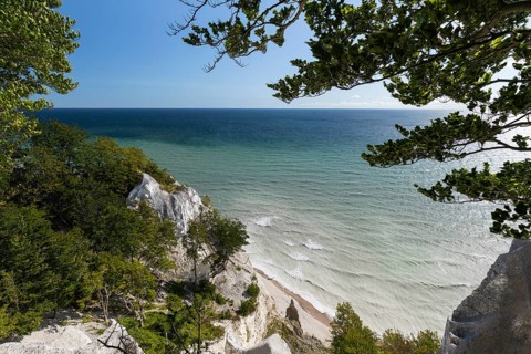 White chalk cliffs at Hundevængsfald with milky water from chalk sediment by the stormy Baltic Sea