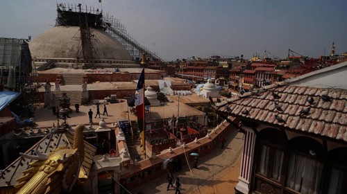 Bodnath stupa under reconstruction after the earthquake, with a view of roofs, Kathmandu, Nepal
